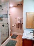 Bathroom has a walk-in shower with new rain shower head and fun tropical fish tiles. Shampoo, conditioner and body wash are available for your use. Vanity has new waterfall faucet.